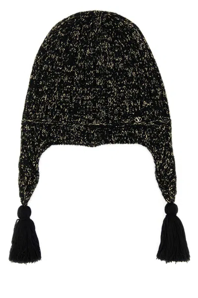Valentino Wool Blend Beanie With Knit Texture And Tassel Embellishments In Black
