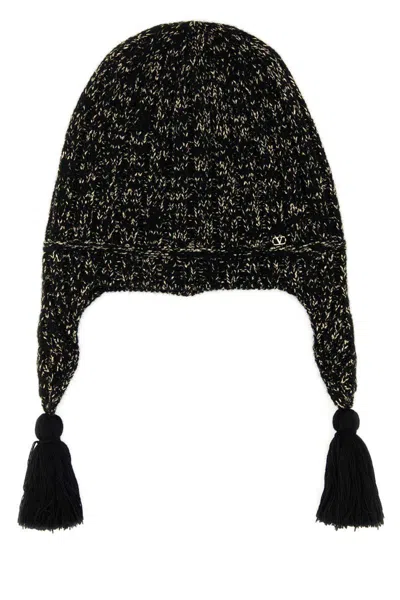 Valentino Wool Blend Beanie With Knit Texture And Tassel Embellishments In Black