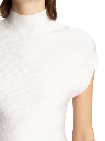 Khaite Andra Mock Neck Peplum Knit Top