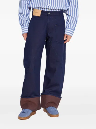 Jw Anderson Blue Jeans With Logo Patch Applied On The Front