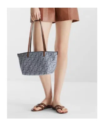 Fendi Textured Leather Thong Sandals With Silhouette In Brown