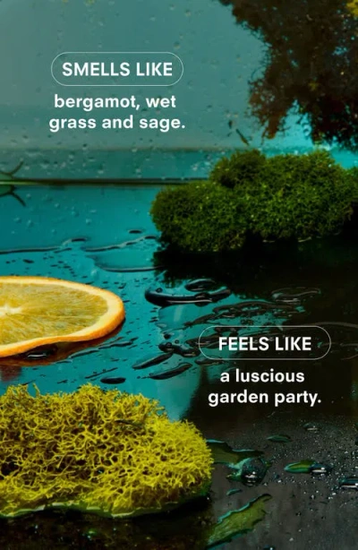 Boy Smells Herbaceous Candle In Green