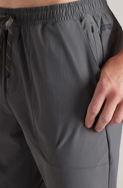 Rhone Pursuit Training Pants In Brown