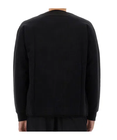 C.p. Company Minimalist Long-sleeve Top With Quilted Texture And Zipper Detail In Black
