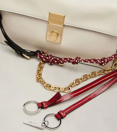 Prada Soft Sound Small Leather Shoulder Bag With Charms In White