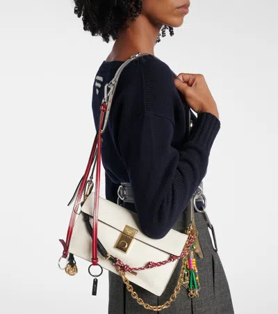 Prada Soft Sound Small Leather Shoulder Bag With Charms In White