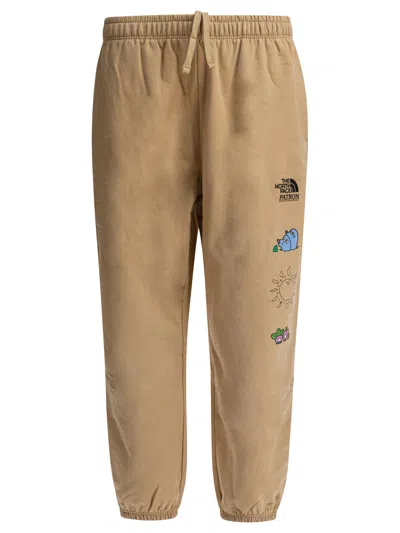 The North Face Graphic Print Elastic Waistband Trousers In Gray