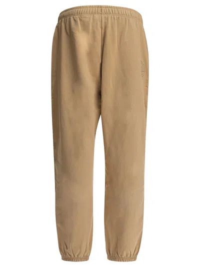 The North Face Graphic Print Elastic Waistband Trousers In Gray