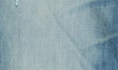 Amiri Men Blue Jeans With Ripped Details On The Front And Logo Patch On The Rear In Denim Man In Blue