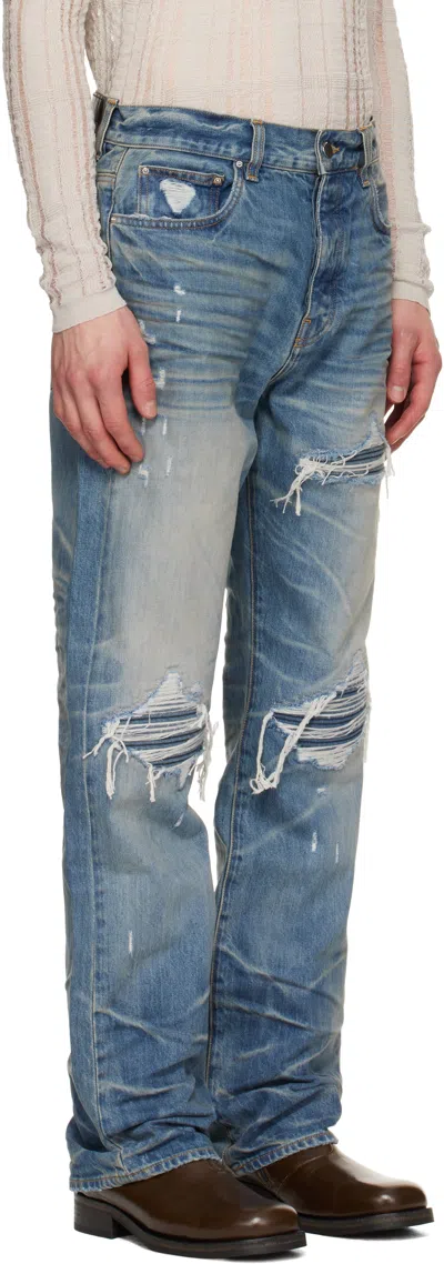 Amiri Men Blue Jeans With Ripped Details On The Front And Logo Patch On The Rear In Denim Man