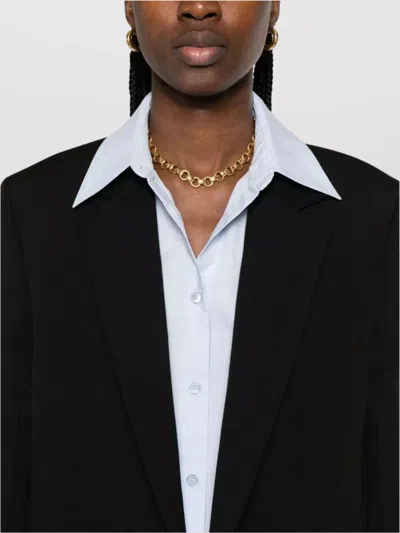 Totême Tailored Single-breasted Coat With Notched Lapels In Black