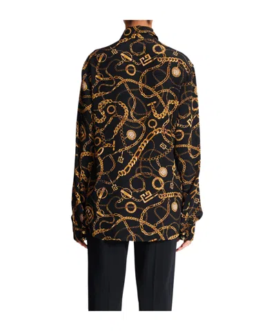 Balmain All-over Graphic Printed Crewneck Shirt In Black
