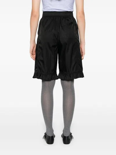 Ganni Flap Pocket Ruffle Hem Shorts In Black