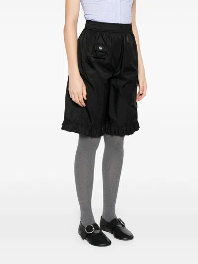Ganni Flap Pocket Ruffle Hem Shorts In Black