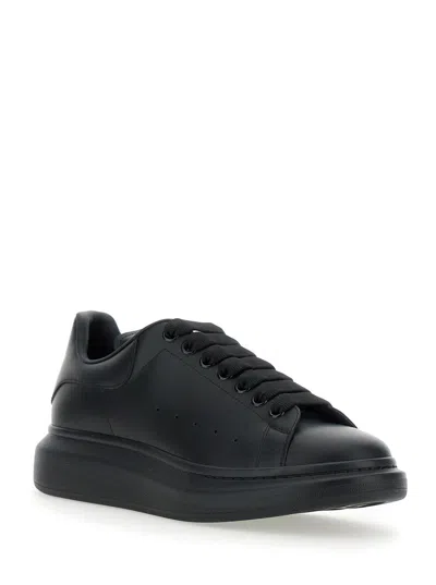 Alexander Mcqueen Black Sneakers With Logo Lettering On The Rear And Oversize Rubber Sole In Leather In Black