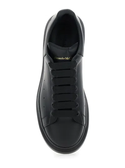 Alexander Mcqueen Black Sneakers With Logo Lettering On The Rear And Oversize Rubber Sole In Leather In Black