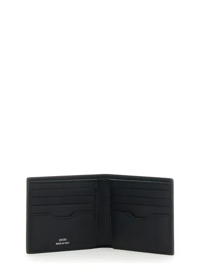 Amiri Bi-fold Wallwt With Logo Lettering On The Front In Leather Man In Black