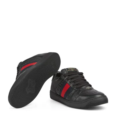 Gucci Gg Embossed Leather Low-top Sneakers In Black