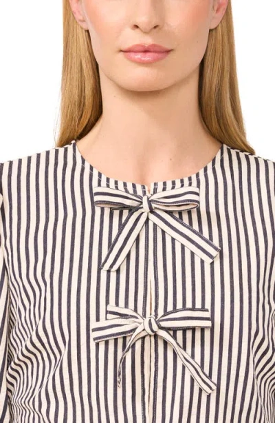 Cece Stripe Bow Front Cotton Peplum Top In Neutral