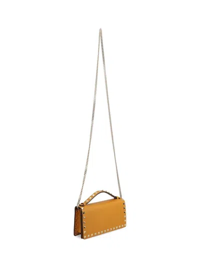 Valentino Rockstud Grainy Leather Wallet On Chain In Yellow