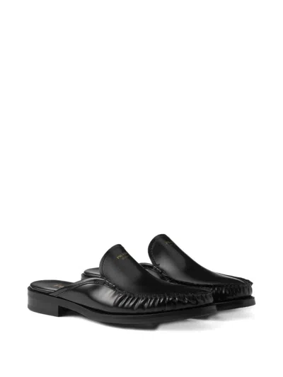 Prada Brushed Leather Mules In Black