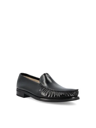 Prada Polished Leather Flat Shoes In Black