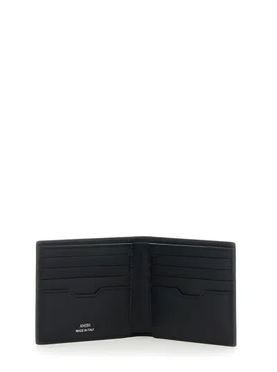 Amiri Bi-fold Wallwt With Logo Lettering On The Front In Leather Man In Black