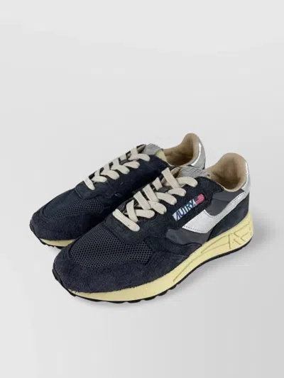Autry Low Top Sneakers Featuring Silver Accents In Blue