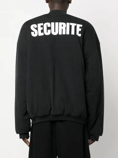 Vetements Slogan-print Cotton Bomber Jacket In Black