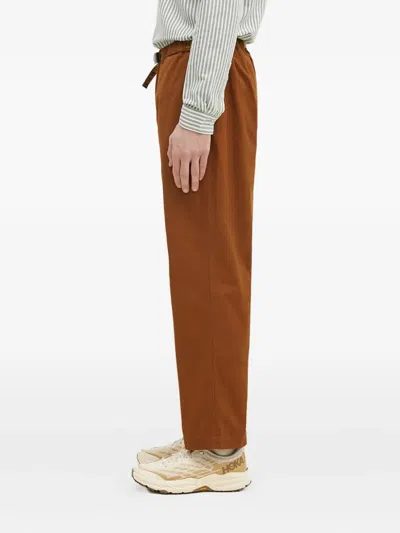 Human Made Slide-buckled Trousers In Brown