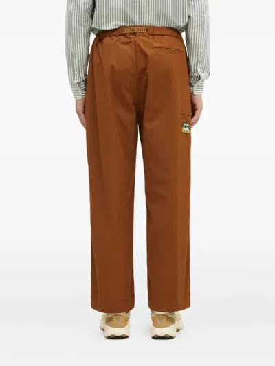 Human Made Slide-buckled Trousers In Brown