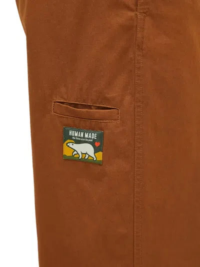 Human Made Slide-buckled Trousers In Brown