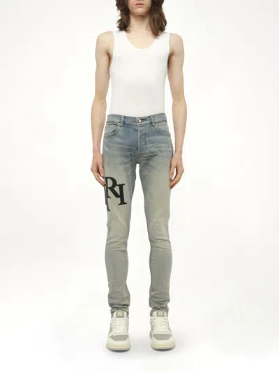 Amiri Men's Staggered Logo Skinny Jeans In Blue