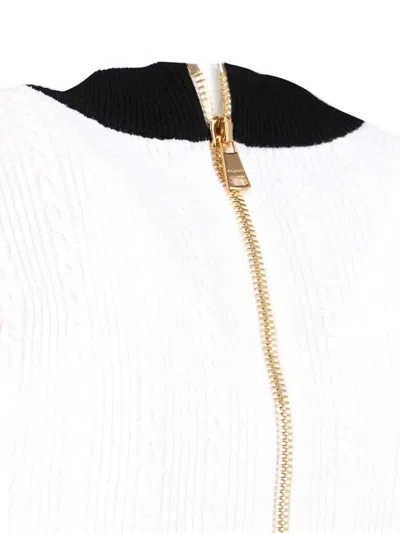 Balmain V-neck Buttoned Strong-shoulder Torsade Knit Mini Dress In Black