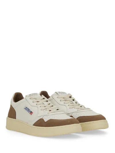 Autry Low Sneaker With Suede Accents And Perforated Toe Box In Neutral
