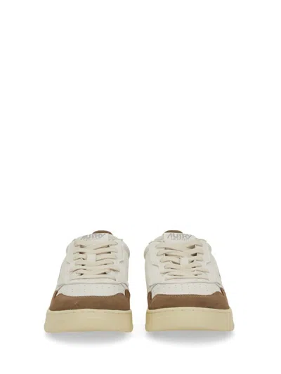 Autry Low Sneaker With Suede Accents And Perforated Toe Box In Neutral