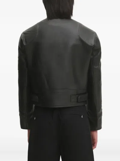 Vetements Logo-embossed Leather Jacket In Black
