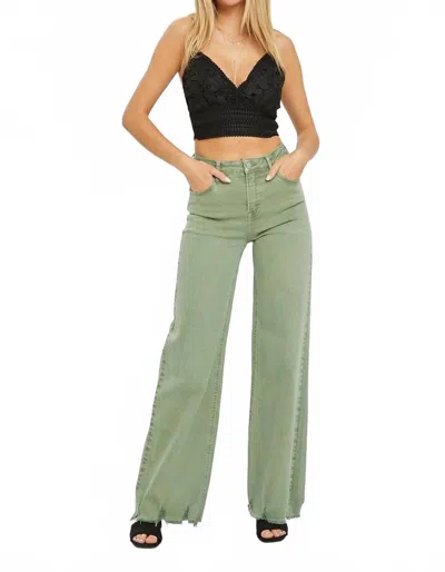 Risen High Rise Wide Leg Frayed Hem Pants In Olive In Green