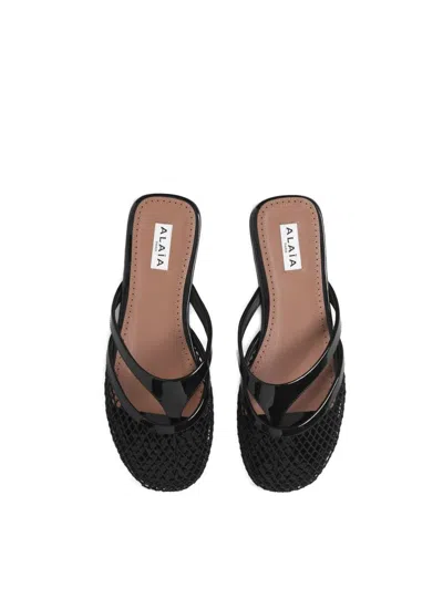 Alaïa Infradito Flat Mules In Fishnet And Leather