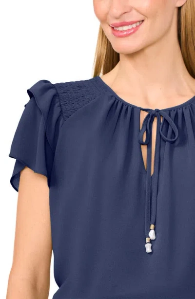 Cece Tie Neck Flutter Sleeve Top In Blue