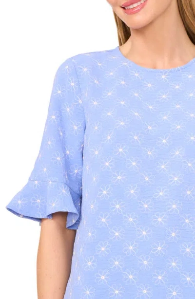 Cece Floral Embroidered Ruffle Cuff Top In Blue