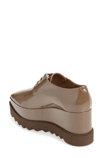 Stella Mccartney Elyse Shiny Patent Wedge Sneakers In Brown