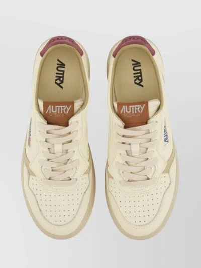 Autry Sneakers With Contrasting Heel Tab And Perforated Toe