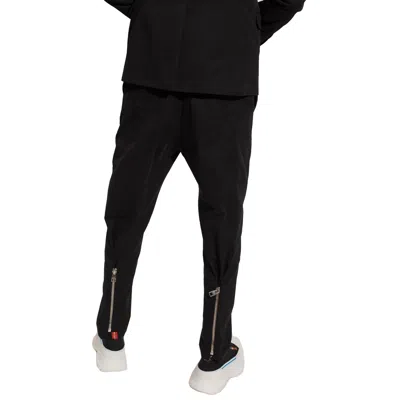 Alexander Mcqueen Pleat-front Trousers In Black