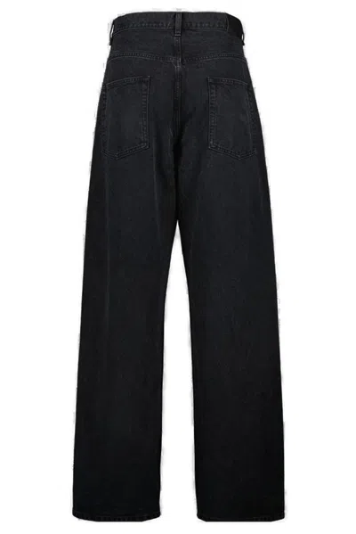 Saint Laurent Carrot-fit Jeans With A Washed Effect In Black