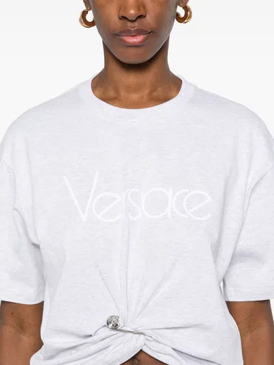 Versace Cropped T-shirt With Twist Detail And Safety Pin Logo