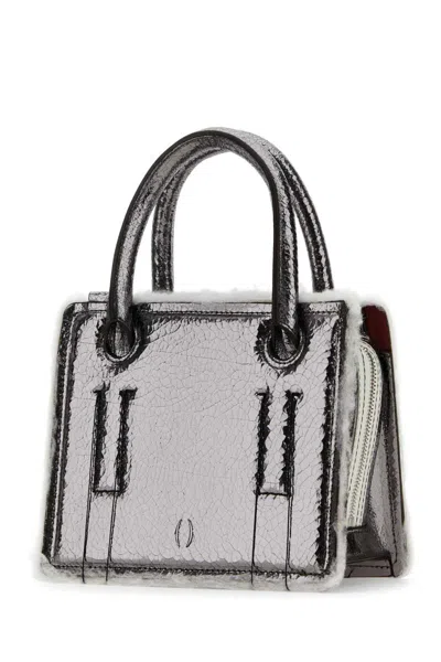 Dentro Handbags.