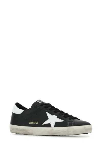 Golden Goose 'super-star' Black Low Top Sneakers With Logo Patch And Suede Details In Leather Man In Black