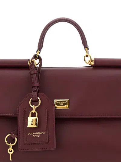 Dolce & Gabbana Bordeaux Handbag With Key And Padlock Detail And Adjustable And Removable Shoulder Strap