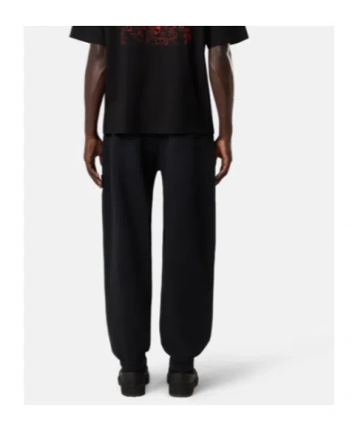 Stone Island Loose-fit Joggers With Pockets And Elasticateed Cuffs In Black